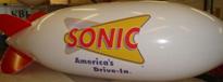 large balloons - 20ft. blimp with Sonic Drive-Ins logo - $1825.00 - plain 20ft. helium blimp from $1334.00 - many blimp colors.